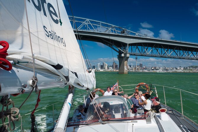 Auckland Harbour Sailboat Cruise Including Three Course Dinner - A small yacht and a big Auckland view