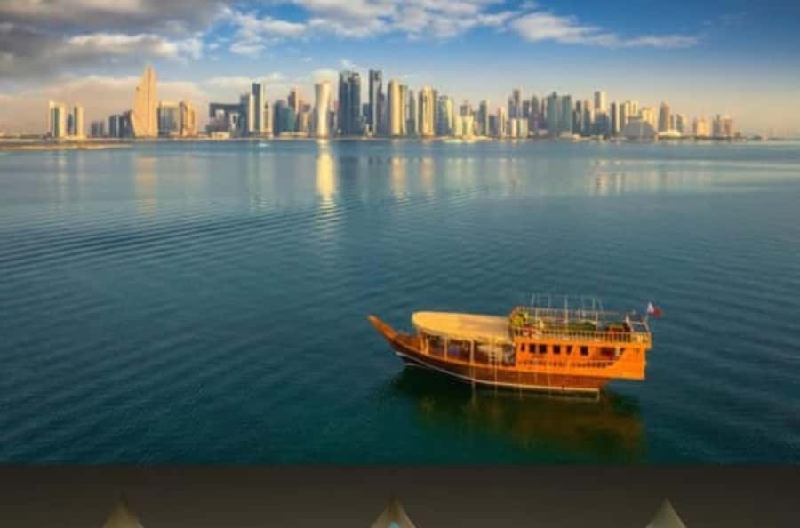 Doha: Traditional Dhow Cruise with Harbour and Skyline View - The Corniche, palms, and skyline from the water