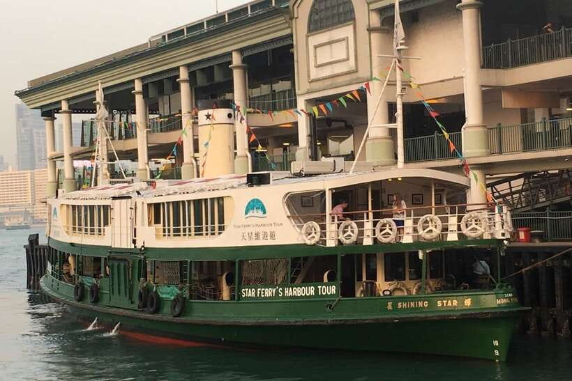 Hong Kong: Star Ferry Victoria Harbour Cruise & Light Show - Open-air decks, seating, and festive details