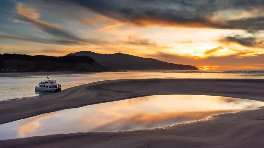 Raglan: Scenic Harbour Sunset Cruise - Leaving Raglan Wharf aboard the Wahinemoe