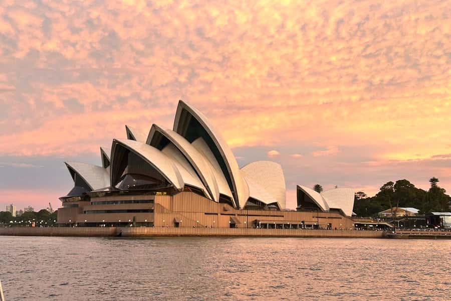 Sydney: Golden Glow Sunset Harbour Cruise with 1 Drink - Sydney at golden hour from the deck of Heaven