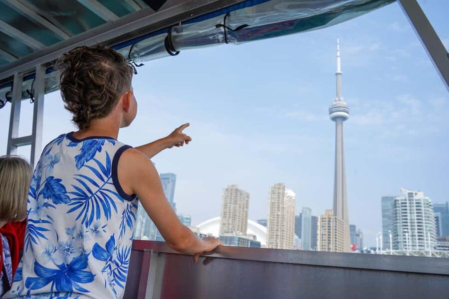 Toronto Downtown Walking Tour With Tower and Harbour Cruise - Passing the Hockey Hall of Fame